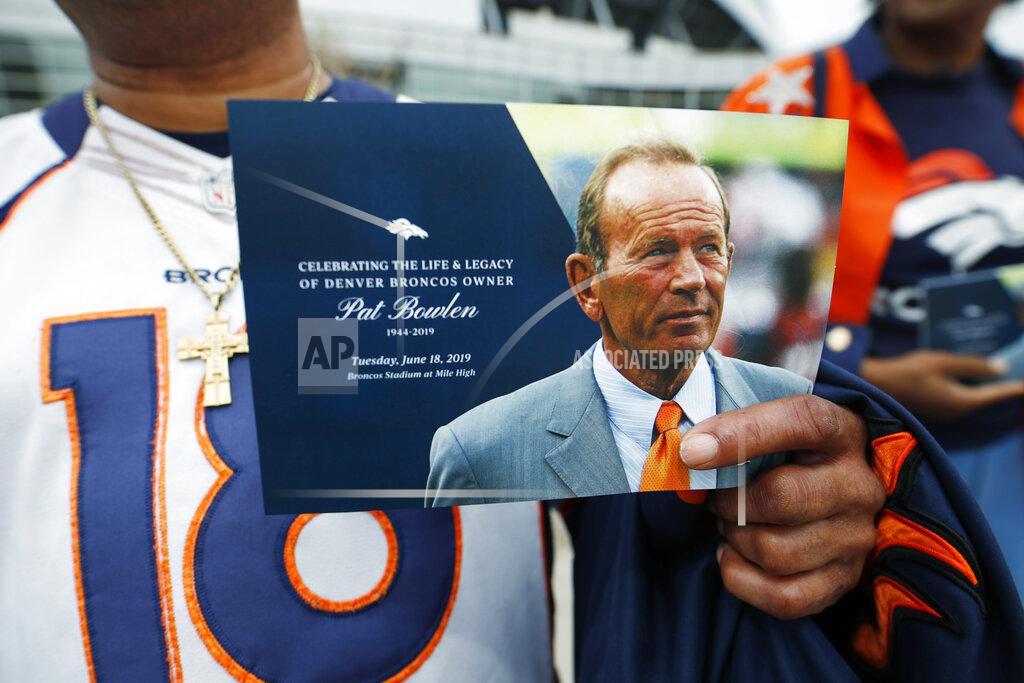 David Zalubowski Denver Broncos fan Clinton Mayfield holds up a card to mark the five-hour memorial for team owner Pat Bowlen Tuesday, June 18, 2019 in at Mile High Stadium, the NFL football team's home in Denver. Bowlen, who has owned the franchise for more than three decades, died last Thursday. (AP Photo/David Zalubowski)