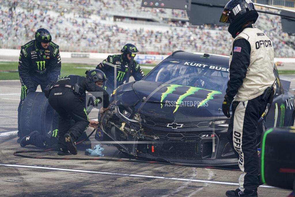 Brynn Anderson NASCAR Cup Series driver Kurt Busch's team works on his car after a wreck preventing him from continuing during a NASCAR Cup Series at Atlanta Motor Speedway on Sunday, March 21, 2021, in Hampton, Ga. (AP Photo/Brynn Anderson)