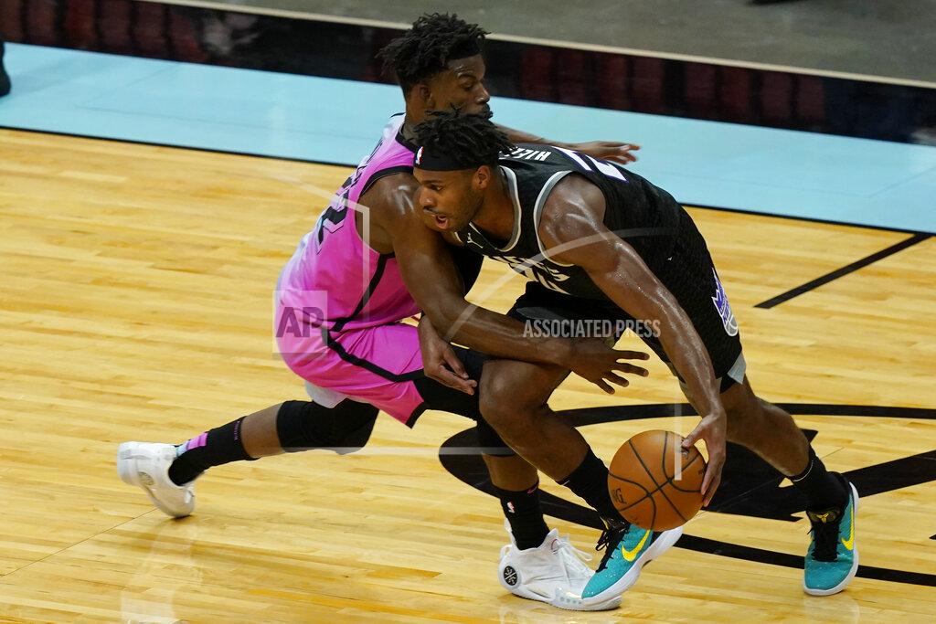 Marta Lavandier Miami Heat forward Jimmy Butler (22) defends Sacramento Kings guard Buddy Hield (24) during the second half of an NBA basketball game, Saturday, Jan. 30, 2021, in Miami. (AP Photo/Marta Lavandier)