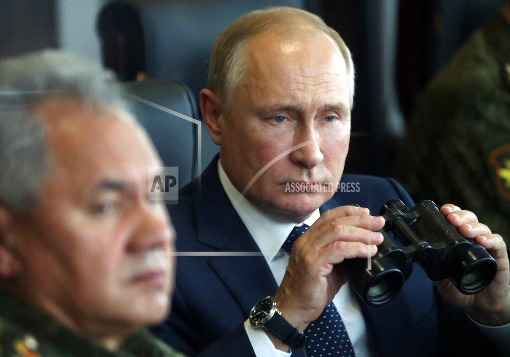 Sergei Savostyanov Russian President Vladimir Putin, right, holds a binoculars as Russian Defense Minister Sergei Shoigu sits near watching the joint strategic exercise of the armed forces of the Russian Federation and the Republic of Belarus Zapad-2021 at the Mulino training ground in the Nizhny Novgorod region, Russia, Monday, Sept. 13, 2021. The military drills attend by servicemen of military units and divisions of the Western Military District, representatives of the leadership headquarters and personnel of military contingents of the armed forces of Armenia, Belarus, India, Kazakhstan, Kyrgyzstan and Mongolia. (Sergei Savostyanov, Sputnik, Kremlin Pool Photo via AP)
