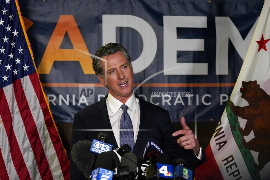 Rich Pedroncelli California Gov. Gavin Newsom addresses reporters after beating back the recall that aimed to remove him from office at the John L. Burton California Democratic Party headquarters in Sacramento, Calif., Tuesday, Sept. 14, 2021. (AP Photo/Rich Pedroncelli)