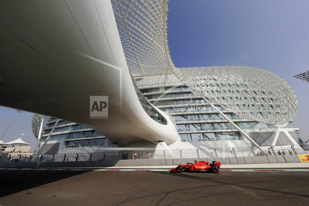 Hassan Ammar Ferrari driver Sebastian Vettel of Germany steers his car during the third free practice at the Yas Marina racetrack in Abu Dhabi, United Arab Emirates, Saturday, Nov. 30, 2019. The Emirates Formula One Grand Prix will take place on Sunday. (AP Photo/Hassan Ammar)