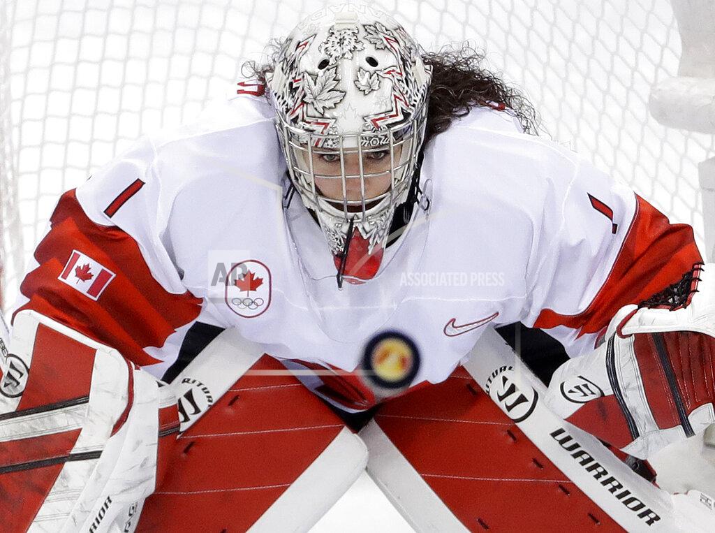 Matt Slocum FILE - In this Thursday, Feb. 22, 2018 file photo, goalie Shannon Szabados (1), of Canada, stares at the flying puck during the second period of the women's gold medal hockey game against the United States at the 2018 Winter Olympics in Gangneung, South Korea. Tyler Tumminia is leaving the door open should members of the Professional Women’s Hockey Players’ Association ever want to reach out to the National Women’s Hockey League in a bid to thaw what’s been a chilly relationship. PWHPA member and former Canadian national team goalie Shannon Szabados was skeptical. “Until I see a league in North America that I would want my daughter to play in, my stance with the PWHPA remains united to create a better opportunity for future generations,” Szabados wrote in a text. (AP Photo/Matt Slocum, File)