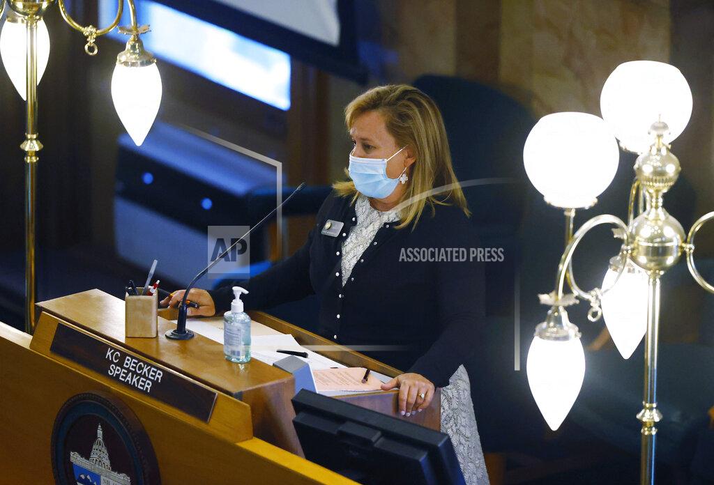 David Zalubowski FILE - In this May 26, 2020, file photo, Colorado Speaker of the House K.C. Becker, D-Boulder, wears a mask as she conducts business in the House of Representatives in Denver. Citing Congress' failure to pass a new economic relief package, Colorado's Democrat-led Legislature convened on Monday, Nov. 30, 2020, in a special session called by Governor Jared Polis to pass bills offering sales tax relief and state grants to small businesses, tenants and public school districts affected by the pandemic. (AP Photo/David Zalubowski, File)