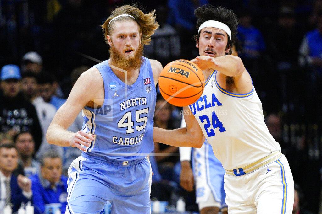 Chris Szagola North Carolina's Brady Manek, left, and UCLA's Jaime Jaquez Jr. battle for the ball during the second half of a college basketball game in the Sweet 16 round of the NCAA tournament, Friday, March 25, 2022, in Philadelphia. (AP Photo/Chris Szagola)