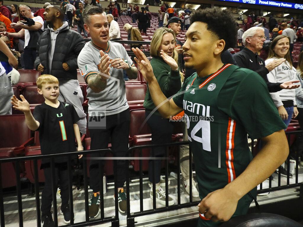 Phil Sears Miami guard Nijel Pack (24) high fives with fans after an NCAA college basketball game against Florida State in Tallahassee, Fla., Tuesday, Jan. 24, 2023. (AP Photo/Phil Sears)