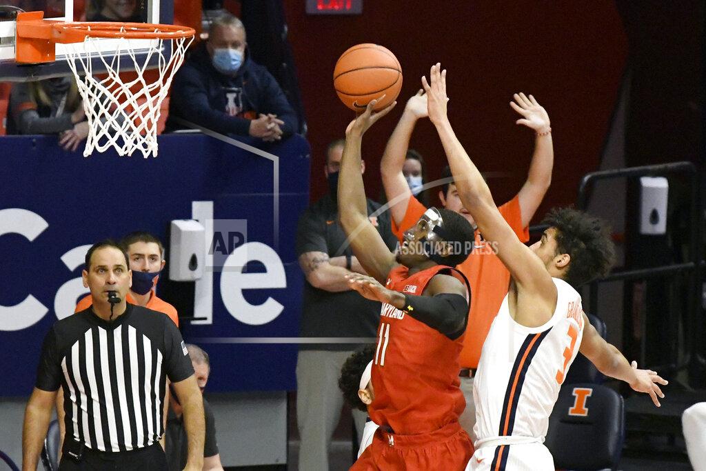 Holly Hart Maryland guard Darryl Morsell (11) shoots as Illinois guard Jacob Grandison (3) defends in the first half of an NCAA college basketball game, Sunday, Jan. 10, 2021, in Champaign, Ill. (AP Photo/Holly Hart)