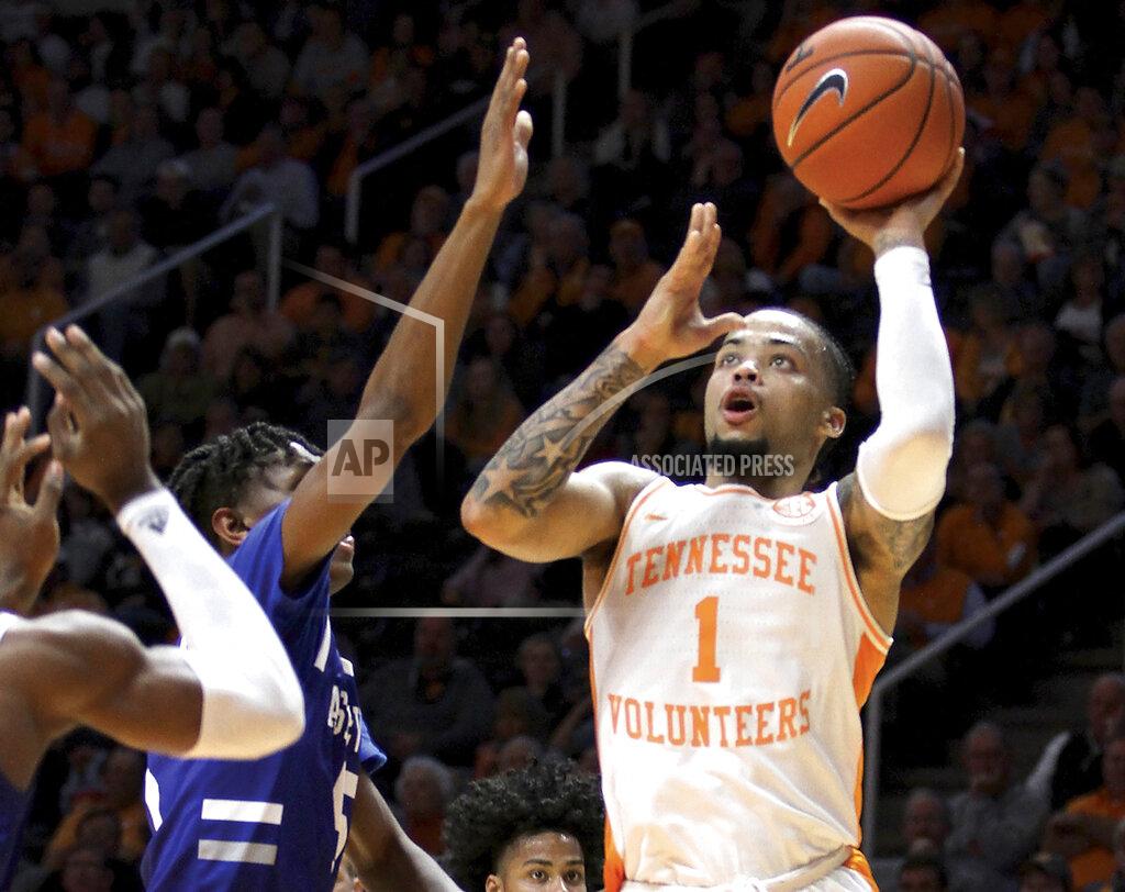 Tom Sherlin Tennessee's Lamonte Turner (1) shoots a short left handed shot in the lane defended by UNC Asheville's Trent Stephney during an NCAA college basketball game Tuesday, Nov. 5, 2019, in Knoxville, Tenn. (Tom Sherlin/The Daily Times via AP)