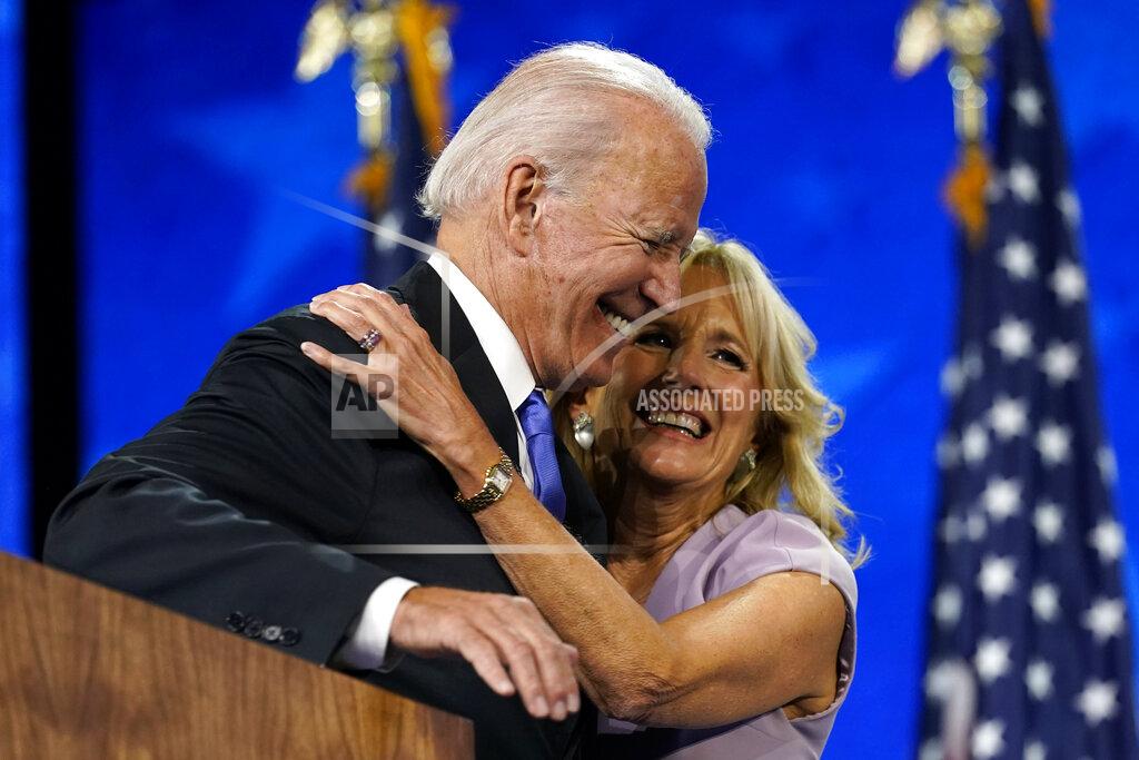 Andrew Harnik FILE - In this Aug. 20, 2020, file photo Democratic presidential candidate former Vice President Joe Biden hugs his wife Jill Biden after his speech during the fourth day of the Democratic National Convention at the Chase Center in Wilmington, Del. (AP Photo/Andrew Harnik, File)