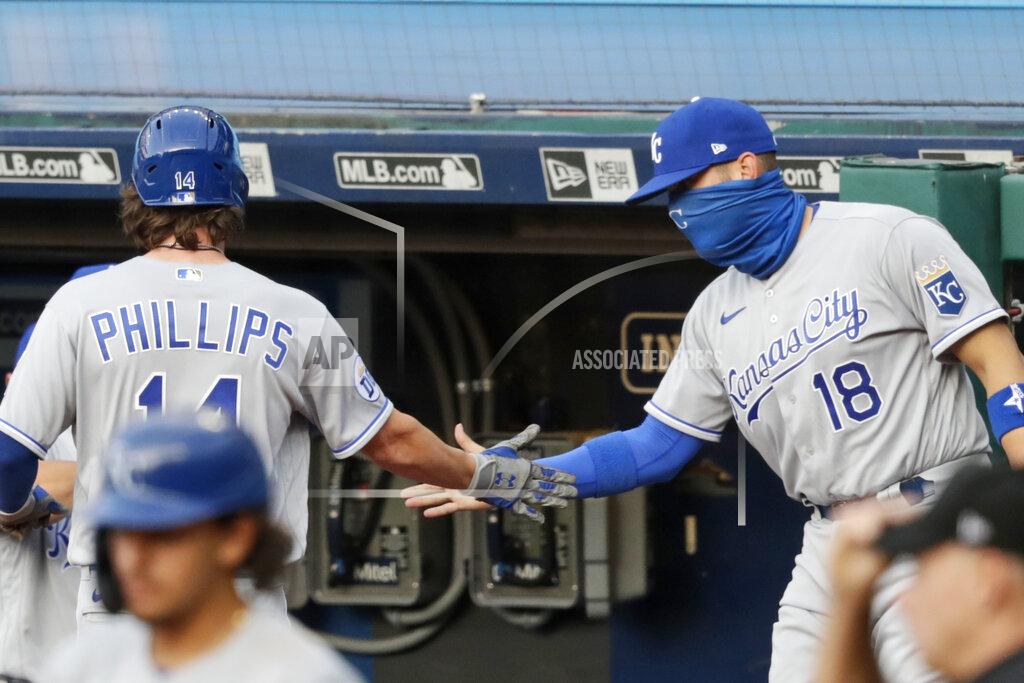 Tony Dejak Kansas City Royals' Brett Phillips, left, is congratulated by Oscar Hernandez after scoring in the 10th inning in a baseball game against the Cleveland Indians, Saturday, July 25, 2020, in Cleveland. (AP Photo/Tony Dejak)