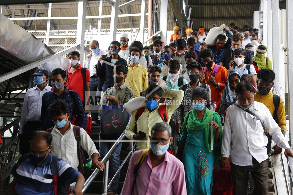 Ajit Solanki Passengers crowd a railway station in Ahmedabad, India, Friday, July 23, 2021. (AP Photo/Ajit Solanki)