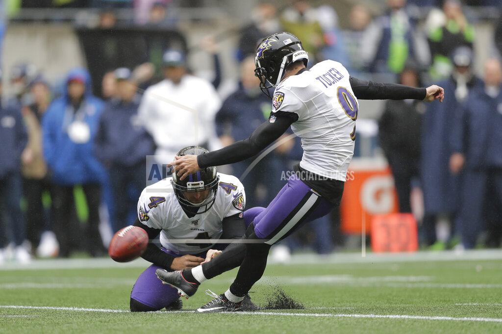 John Froschauer Baltimore Ravens kicker Justin Tucker kicks a field goal against the Seattle Seahawks as Sam Koch holds during the first half of an NFL football game, Sunday, Oct. 20, 2019, in Seattle. (AP Photo/John Froschauer)