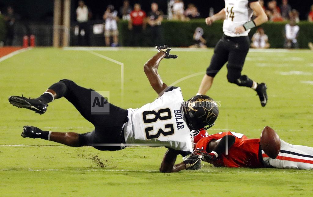 John Bazemore Vanderbilt wide receiver C.J. Bolar (83) fumbles after being hit by Georgia defensive back Richard LeCounte (2) during the second half of an NCAA college football game Saturday, Oct. 6, 2018, in Atlanta, Ga. Vanderbilt recovered. (AP Photo/John Bazemore)