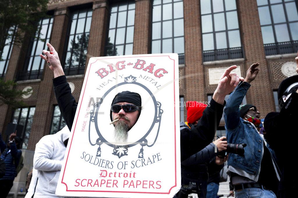 Jacob Hamilton Attendees smoke joints at a Hash Bash event at the University of Michigan in Ann Arbor, Mich., Saturday, April 3, 2021.( Jacob Hamilton/Ann Arbor News via AP)