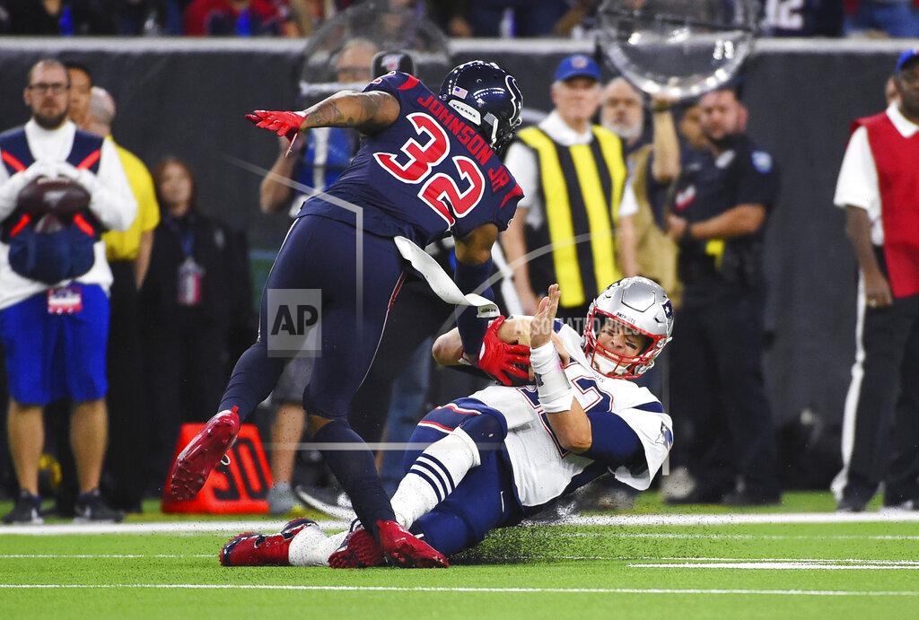 Eric Christian Smith New England Patriots quarterback Tom Brady (12) slide into Houston Texans cornerback Lonnie Johnson (32) on a run during the first half of an NFL football game Sunday, Dec. 1, 2019, in Houston. (AP Photo/Eric Christian Smith)