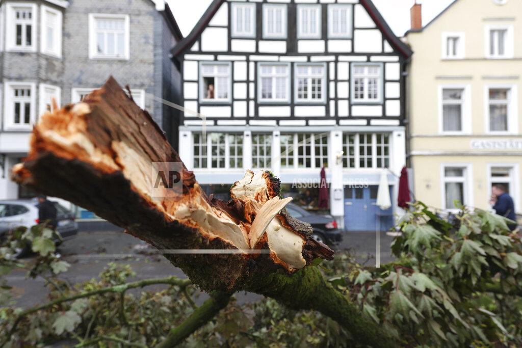 Friso Gentsch View of a snapped-off tree trunk from severe weather in front of a house facade in Lippstadt, Germany, Friday, May 20, 2022. (Friso Gentsch/dpa via AP)