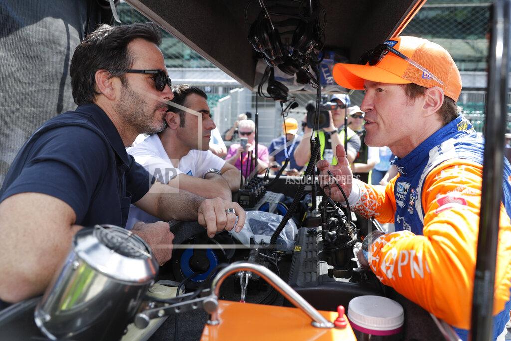 Michael Conroy Scott Dixon, right, of New Zealand, talks with NASCAR driver Jimmy Johnson, left, and three-time Indy 500 champion Dario Franchitti, center, during practice for the Indianapolis 500 IndyCar auto race at Indianapolis Motor Speedway, Thursday, May 16, 2019 in Indianapolis. (AP Photo/Michael Conroy)