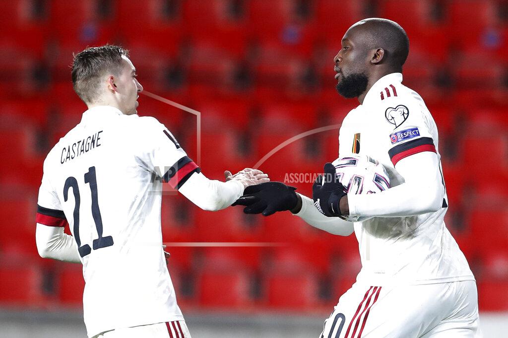 Petr David Josek Belgium's Romelu Lukaku, right, celebrates with Timothy Castagne after scoring his side???s first goal during the World Cup 2022 group E qualifying soccer match between Czech Republic and Belgium at the Sinobo stadium in Prague, Czech Republic, Saturday, March 27, 2021. (AP Photo/Petr David Josek)
