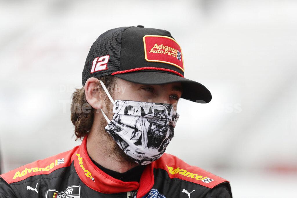 FILE - This June 7, 2020, file photo shows Ryan Blaney waiting in pit row before a NASCAR Cup Series auto race at Atlanta Motor Speedway in Hampton, Ga. With a bit of disbelief over his fast fall in NASCAR's standings, Ryan Blaney is determined to avoid elimination from the playoffs. (AP Photo/Brynn Anderson, File)