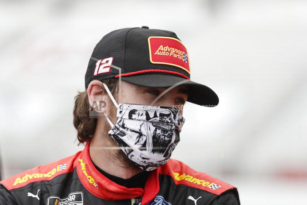 FILE - This June 7, 2020, file photo shows Ryan Blaney waiting in pit row before a NASCAR Cup Series auto race at Atlanta Motor Speedway in Hampton, Ga. With a bit of disbelief over his fast fall in NASCAR's standings, Ryan Blaney is determined to avoid elimination from the playoffs. (AP Photo/Brynn Anderson, File)