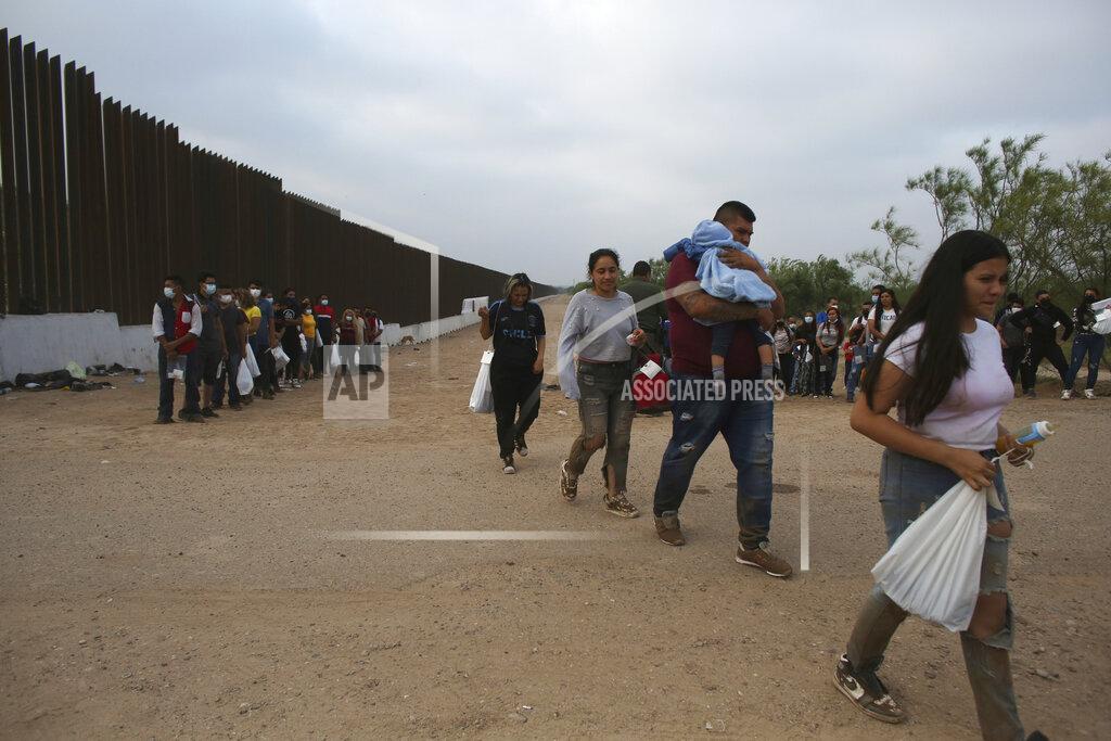 Dario Lopez-Mills Migrants who had crossed the Rio Grande river into the United States are taken away by U.S. Border Patrol agents in Eagle Pass, Texas, Friday, May 20, 2022. As U.S. officials anxiously waited, many of the migrants crossing the border from Mexico on Friday were oblivious to a pending momentous court ruling on whether to maintain pandemic-related powers that deny a chance to seek asylum on grounds of preventing the spread of COVID-19. (AP Photo/Dario Lopez-Mills)
