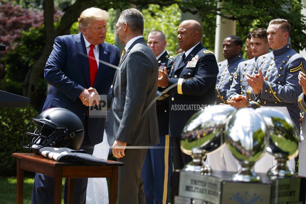 Evan Vucci President Donald Trump shakes hands with Army football coach Jeff Monken during the presentation of the Commander-in-Chief's Trophy to the U.S. Military Academy at West Point football team, in the Rose Garden of the White House, Monday, May 6, 2019, in Washington. (AP Photo/Evan Vucci)