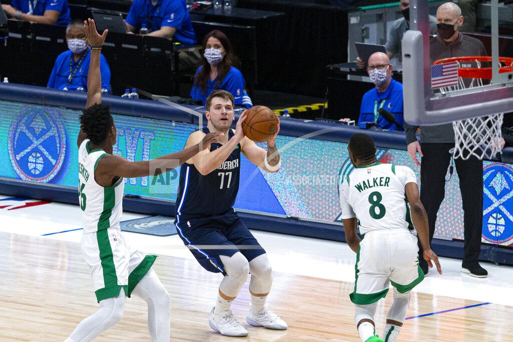 Sam Hodde Dallas Mavericks guard Luka Doncic (77) shoots as Boston Celtics forward Aaron Nesmith (26) attempts to defend during the second half of an NBA basketball game in Dallas, Tuesday, Feb. 23, 2021. (AP Photo/Sam Hodde)