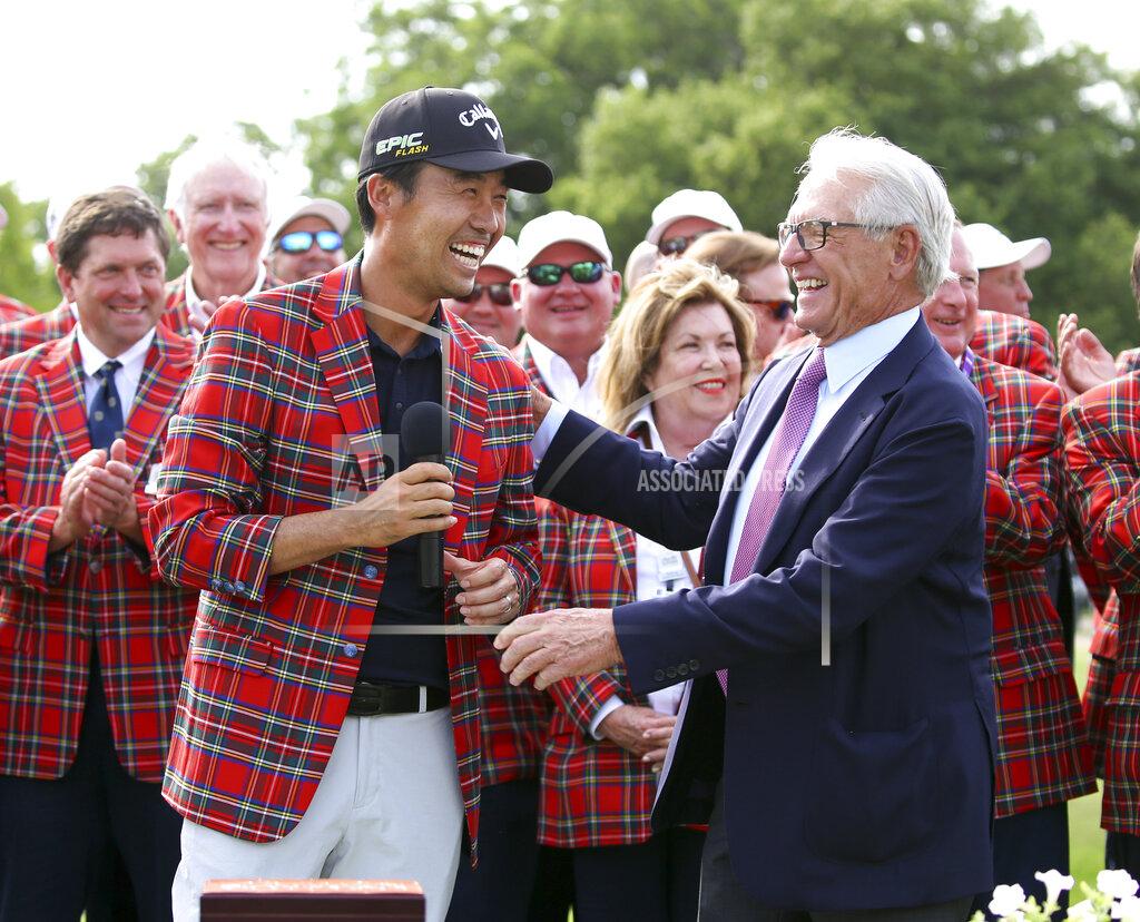 FILE - In this May 26, 2019, file photo, Kevin Na, front left, is congratulated by Charles Schwab after winning The Charles Schwab Challenge at Colonial in Fort Worth, Texas. The PGA Tour laid out an ambitious plan to resume its season Thursday, April 16, 2020, with hopes of a restart at Colonial on June 11-14 and keeping fans away for at least the first month. (AP Photo/ Richard W. Rodriguez, File)