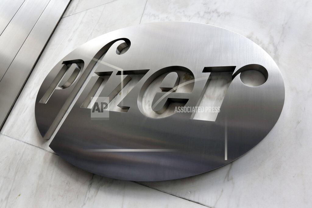File- This Dec. 4, 2017, photo shows the Pfizer company logo at the company's headquarters in New York. The federal government has agreed to pay nearly $2 billion for 100 million doses of a potential COVID-19 vaccine being developed by the U.S. drugmaker and its German partner BioNTech. (AP Photo/Richard Drew, File)