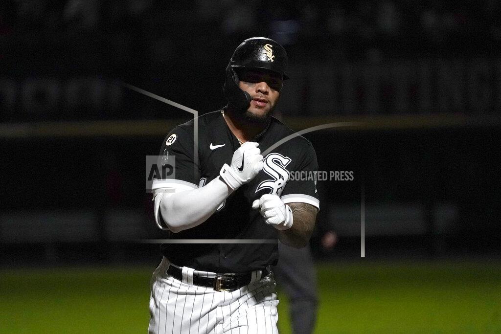 Charles Rex Arbogast Chicago White Sox's Yoan Moncada celebrates while running the bases on a home run off Los Angeles Angels starting pitcher Janson Junk as the stadium lights flicker in a strobe-light fashion during the fourth inning of a baseball game Wednesday, Sept. 15, 2021, in Chicago. (AP Photo/Charles Rex Arbogast)