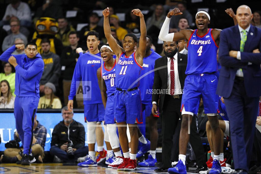 Charlie Neibergall FILE - In this Nov. 11, 2019, file photo, DePaul guard Charlie Moore (11) and teammates celebrate on the bench during the first half of the team's NCAA college basketball game against Iowa in Iowa City, Iowa. The Blue Demons are 8-0 for the first time since the 1986-87 team won its first 16 games and turning heads in a way the once-proud program hasn’t in years. With NCAA runner-up Texas Tech visiting on Wednesday, they could really open some eyes. DePaul already has road wins over Iowa, Boston College and Minnesota. (AP Photo/Charlie Neibergall, File)
