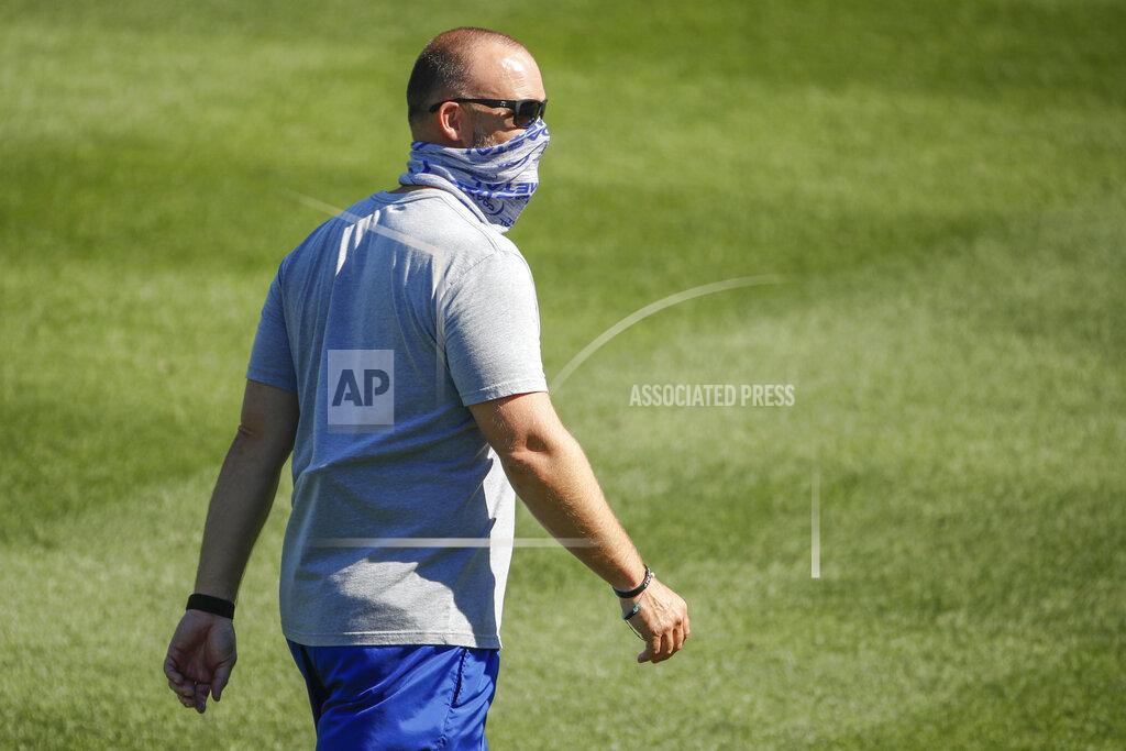 Kamil Krzaczynski Chicago Cubs manager David Ross walks on the field during baseball practice at Wrigley Field on Friday, July 3, 2020 in Chicago. (AP Photo/Kamil Krzaczynski)