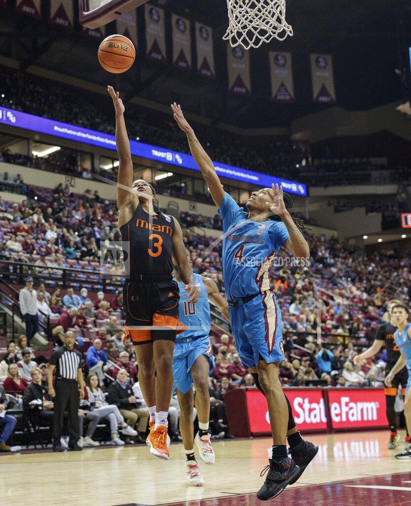 Alicia Devine Miami guard Charlie Moore (3) shoots against Florida State during an NCAA college basketball game at the Tucker Civic Center on Tuesday, Jan. 11, 2022, Tallahassee, Fla. (Alicia Devine/Tallahassee Democrat via AP)
