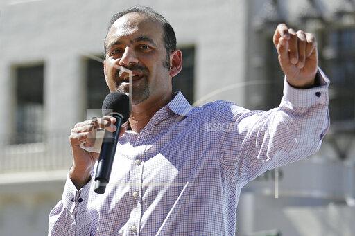 FILE - In this March 14, 2017, file photo Dilawar Syed, president of the software company Freshdesk, speaks during a Tech Stands Up rally outside City Hall in Palo Alto, Calif. If Syed is confirmed as deputy administrator of the Small Business Administration, he will be the highest-ranking Muslim in U.S. government. But his nomination is in peril as Senate Republicans block a committee vote, citing the agency's payouts to abortion providers — the latest in a series of objections to the Pakistani-born businessman's confirmation .(AP Photo/Eric Risberg, File)