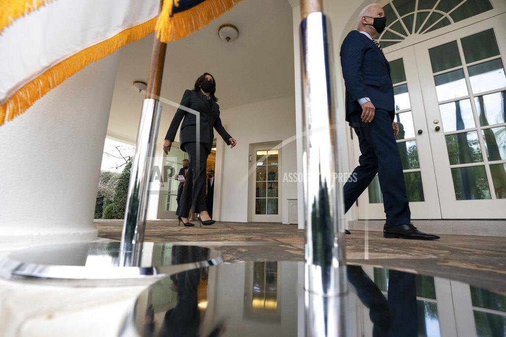 Alex Brandon President Joe Biden, right, followed by Vice President Kamala Harris, walks out of the Oval Office to speak about the American Rescue Plan, a coronavirus relief package, in the Rose Garden of the White House, Friday, March 12, 2021, in Washington. (AP Photo/Alex Brandon)