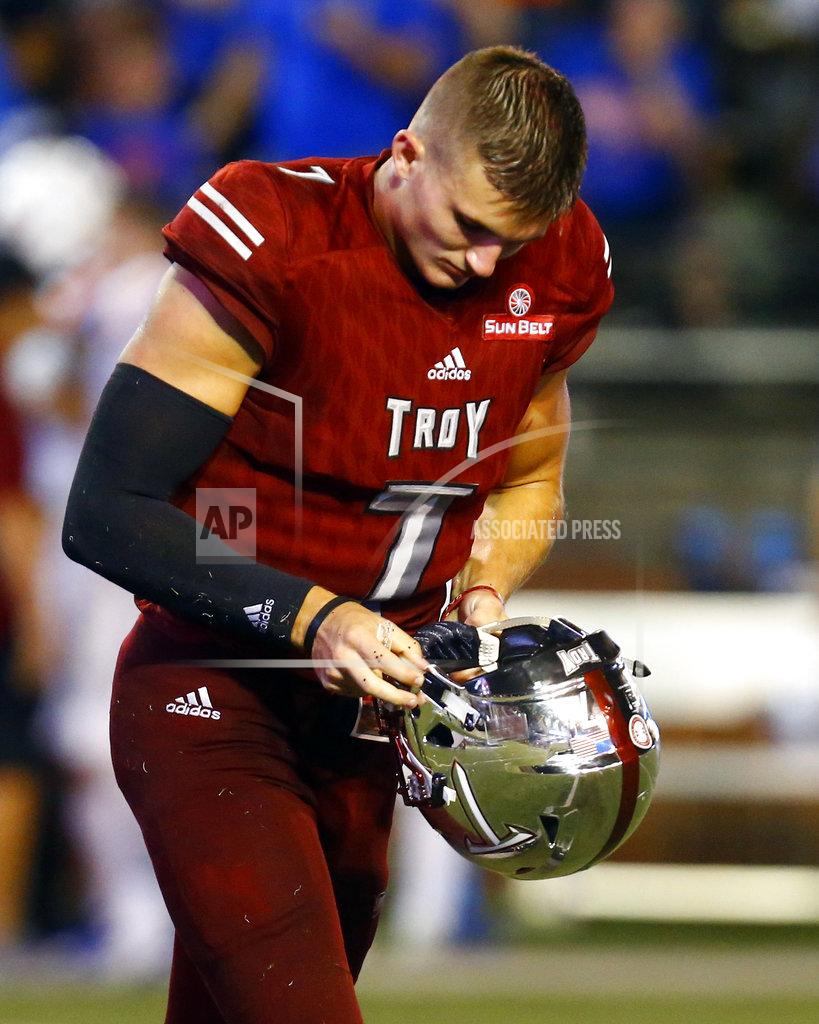 Butch Dill Troy quarterback Kaleb Barker walks off the field after a fumble was returned for a touchdown by Boise State cornerback Tyler Horton during the second half of an NCAA college football game, Saturday, Sept. 1, 2018, in Troy, Ala. (AP Photo/Butch Dill)