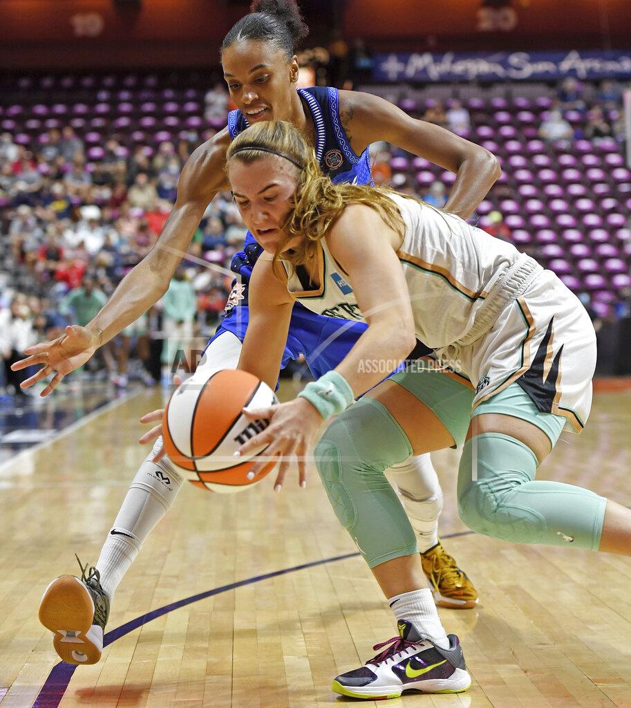 Sean D. Elliot New York Liberty guard Sabrina Ionescu steals the ball from Connecticut Sun forward DwWanna Bonner during the first half of a WNBA basketball game Wednesday, Sept. 15, 2021, in Uncasville, Conn. (Sean D. Elliot/The Day via AP)