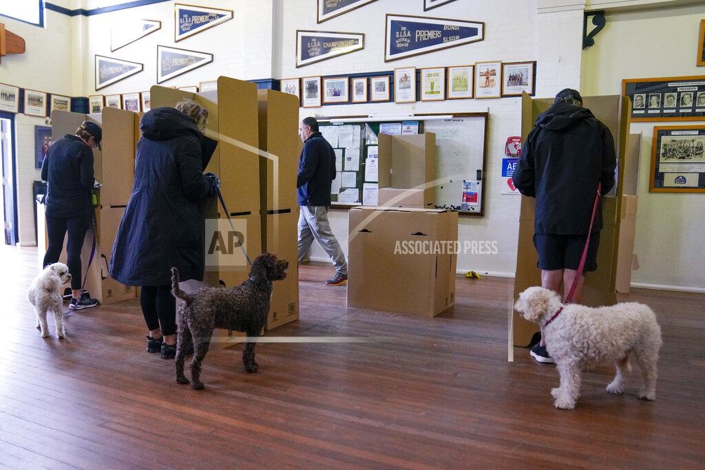 Mark Baker Citizens cast their votes at a polling booth in Sydney, Australia, Saturday, May 21, 2022. Australians go to the polls Saturday following a six-week election campaign that has focused on pandemic-fueled inflation, climate change and fears of a Chinese military outpost being established less than 1,200 miles off Australia's shore.(AP Photo/Mark Baker)
