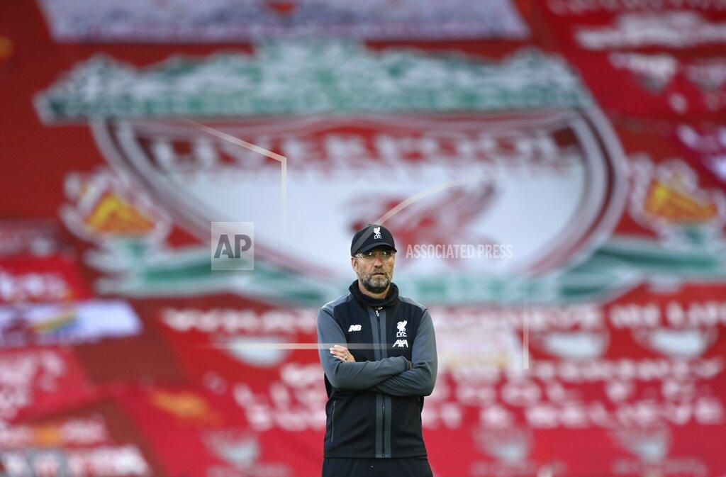 Shaun Botterill Liverpool's manager Jurgen Klopp stands on the pitch before the English Premier League soccer match between Liverpool and Crystal Palace at Anfield Stadium in Liverpool, England, Wednesday, June 24, 2020. (Shaun Botterill/Pool via AP)
