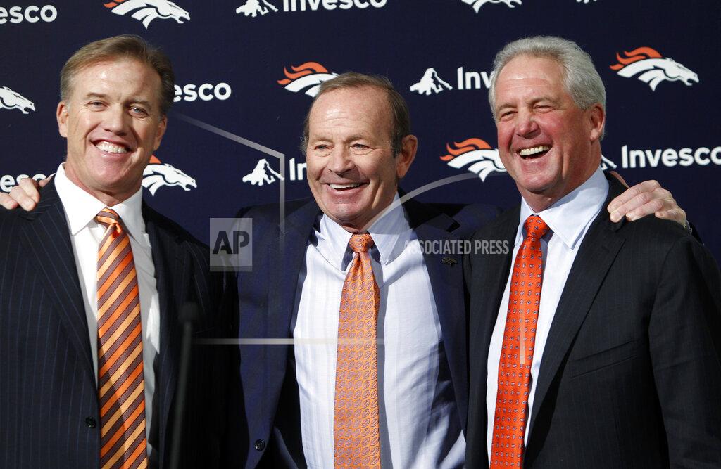 Ed Andrieski FILE - In this Jan. 14, 2011, file photo, Denver Broncos NFL football team owner Pat Bowlen is flanked by John Elway, left, Executive V.P. of football operations and John Fox, head coach, at the teams headquarters in Englewood, Colo. The late Pat Bowlen will be inducted into the Pro Football Hall of Fame in Canton, Ohio on Aug. 3, 2019.(AP Photo/ Ed Andrieski, File)