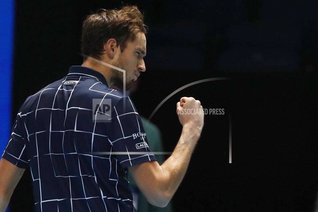 Frank Augstein Daniil Medvedev of Russia gestures to a television camera after he wins match point against Dominic Thiem of Austria during their singles final tennis match at the ATP World Finals tennis tournament at the O2 arena in London, Sunday, Nov. 22, 2020. (AP Photo/Frank Augstein)