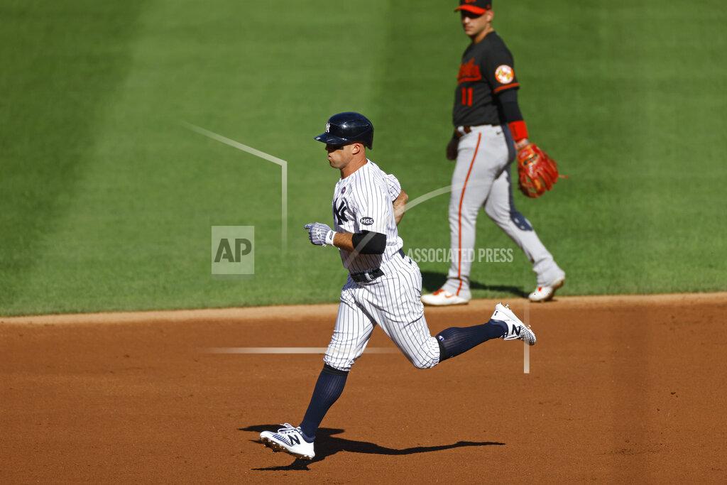 Adam Hunger New York Yankees' Brett Gardner rounds the bases past Baltimore Orioles shortstop Jose Iglesias after hitting a two-run home run during the first inning of the first baseball game of a doubleheader, Friday, Sept. 11, 2020, in New York. (AP Photo/Adam Hunger)