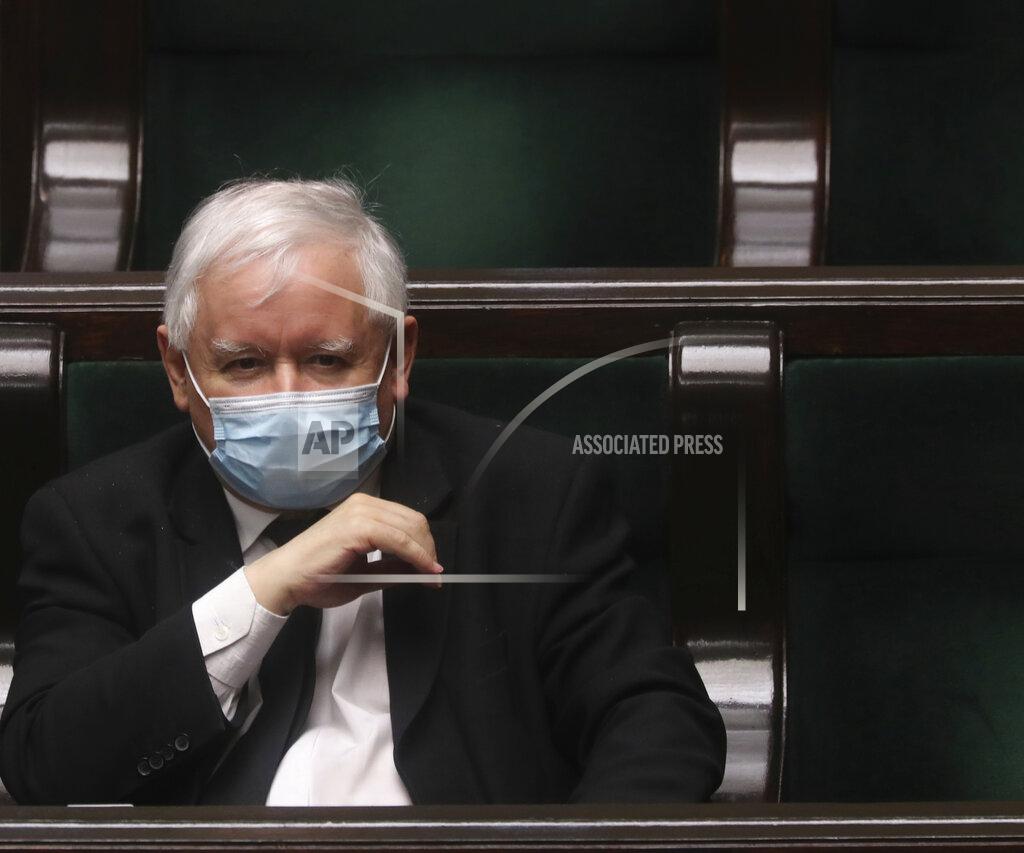 Leader of Poland's ruling Law and Justice party, Jaroslaw Kaczynski, wearing a face mask to protect against the coronavirus, sits in parliament in Warsaw, Poland, on Wednesday, May 6, 2020, ahead of the debate on the postal presidential election that is scheduled for Sunday The ruling party wants the election in May, the Senate is calling for a state of natural disaster that would allow for postponement by three months. (AP Photo/Czarek Sokolowski)
