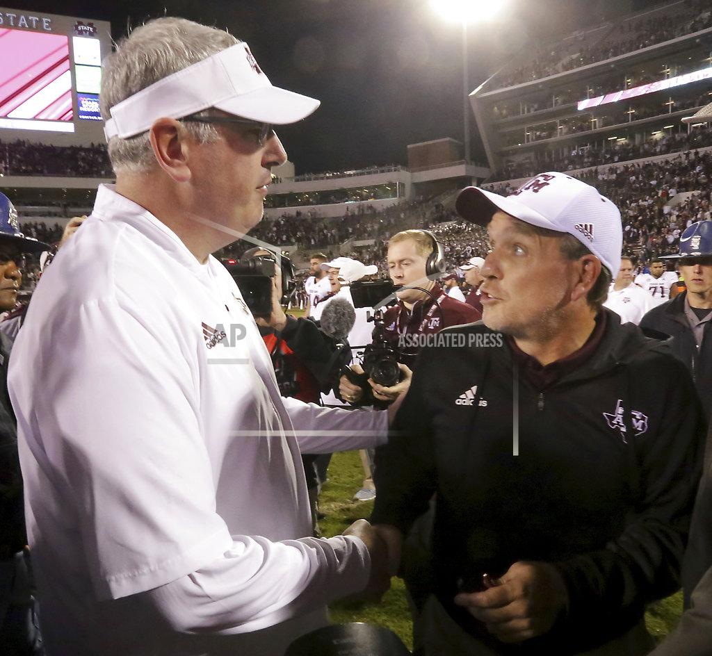 Jim Lytle Texas A&M head coach Jimbo Fisher, right, congratulates Mississippi State head coach Joe Moorhead, left, after an NCAA college football game on Saturday, Oct. 27, 2018, in Starkville, Miss. (AP Photo/Jim Lytle)