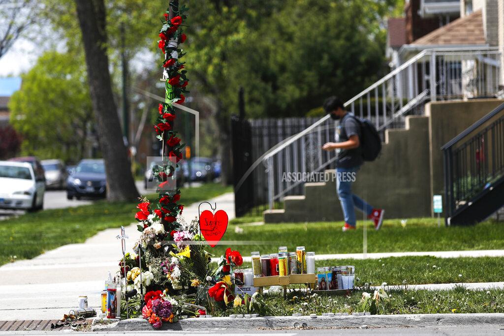 A memorial is set up near the site where 22-year-old Anthony Alvarez was shot several weeks ago during a foot pursuit by Chicago police in Chicago's Portage Park on Tuesday, April 27, 2021 in Chicago. Chicago’s independent police review board has released video of the 22-year-old Latino man who was shot in the back late last month during a foot chase. (Jose M. Osorio /Chicago Tribune via AP)