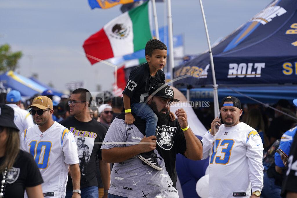 Marcio Jose Sanchez Fans for the Los Angeles Chargers and the Las Vegas Raiders tailgate in front of SoFi stadium before an NFL football game, Monday, Oct. 4, 2021, in Inglewood, Calif. (AP Photo/Marcio Jose Sanchez)