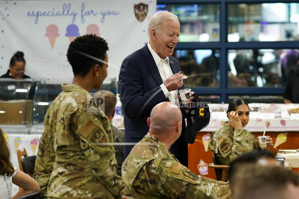 Evan Vucci U.S. President Joe Biden eats ice cream as Biden meets with American service members and their family at Osan Air Base, Sunday, May 22, 2022, in Pyeongtaek, South Korea. (AP Photo/Evan Vucci)