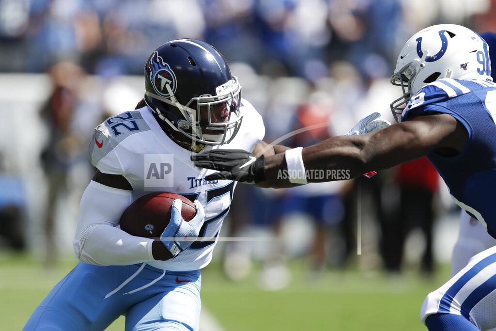 James Kenney Tennessee Titans running back Derrick Henry (22) carries the ball against Indianapolis Colts defensive end Justin Houston (99) in the first half of an NFL football game Sunday, Sept. 15, 2019, in Nashville, Tenn. (AP Photo/James Kenney)