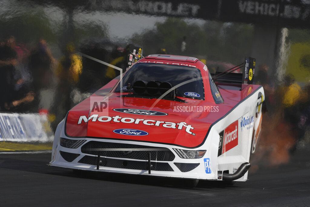 Jerry Foss In this photo provided by the NHRA, Bob Tasca III is back in the seat of his Funny Car and powers his way to the top of field after a battle of COVID-19, Saturday, July 18, 2020, at Lucas Oil Raceway in Indianapolis. (Jerry Foss/NHRA via AP)