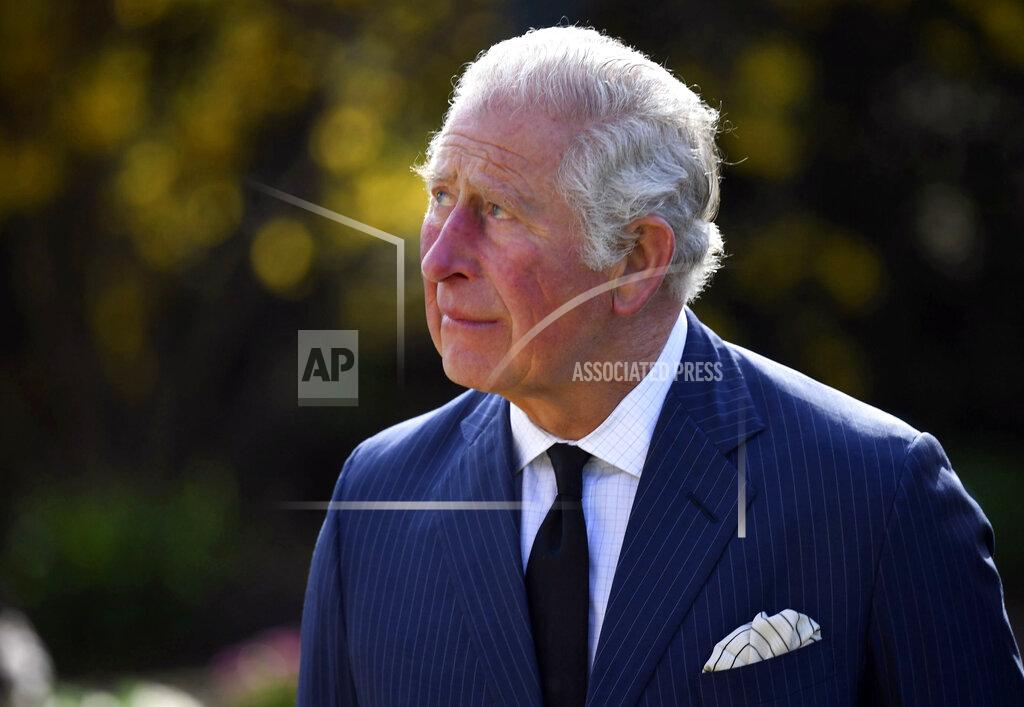 Jeremy Selwyn Britain's Prince Charles, with Camilla, Duchess of Cornwall, visits the gardens of Marlborough House, London, Thursday April 15, 2021, to look at the flowers and messages left by members of the public outside Buckingham Palace, following the death of Prince Philip. (Jeremy Selwyn/Pool via AP)